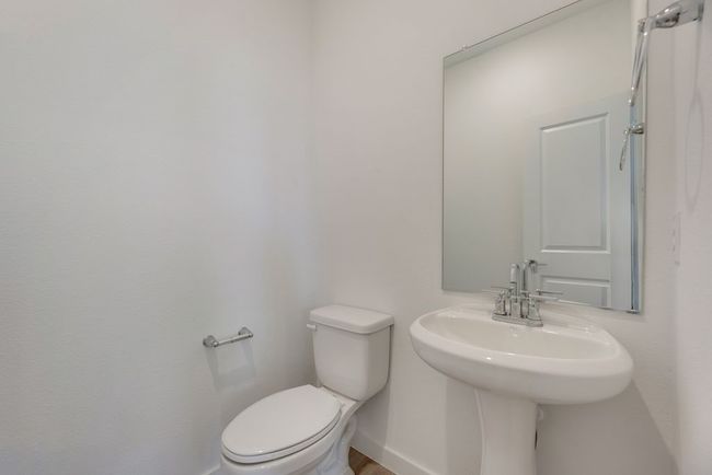 Half bathroom featuring toilet | Image 12