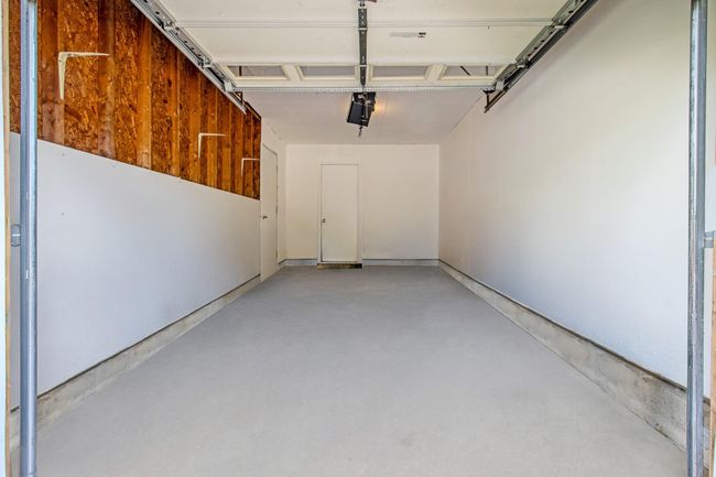 Garage with a garage door opener | Image 30