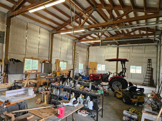 Garage with a workshop area | Image 28