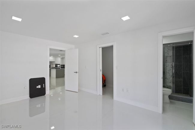 Unfurnished room featuring baseboards and visible vents | Image 15