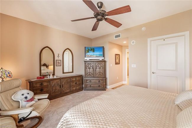 Carpeted bedroom with ceiling fan | Image 32