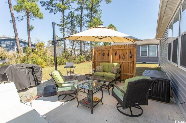 View of patio featuring an outdoor hangout area and a grill | Image 34