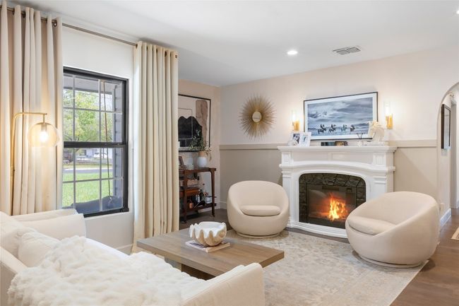 With a full-price offer, the buyer will receive: ? the beautifully styled fireplace ? cozy couch ? two inviting chairs | Image 9