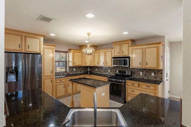 Notice the expansive prep space and ample cabinet storage. | Image 16