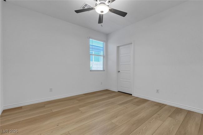Spare room with light wood-style flooring, a ceiling fan, and baseboards | Image 19