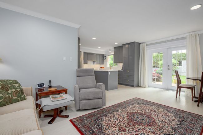 Living room with recessed lighting and crown molding | Image 9