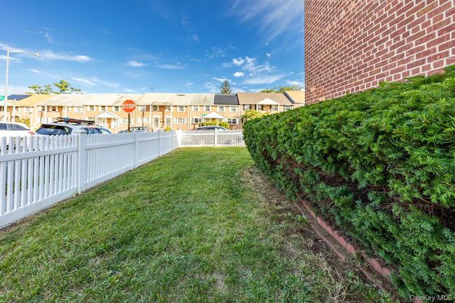 View of fenced backyard | Image 25