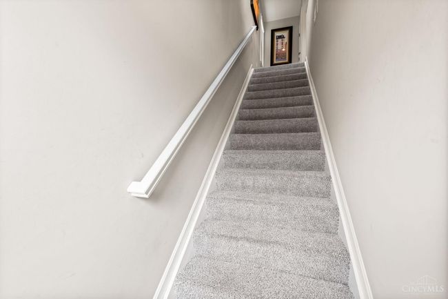 LVP flooring at entrance and steps go up to Kimbell floor plan. | Image 5