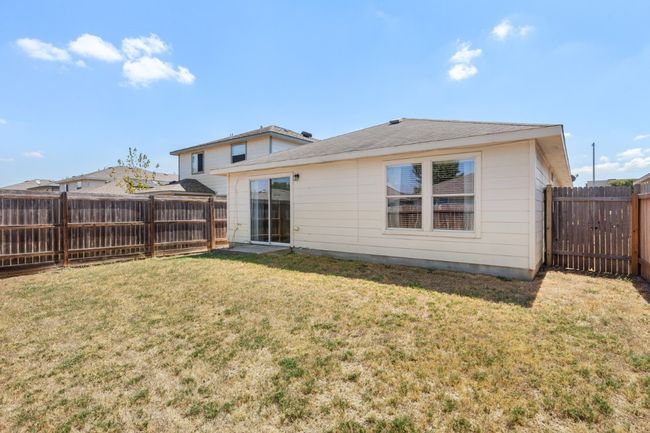 Back of property featuring a fenced backyard | Image 26