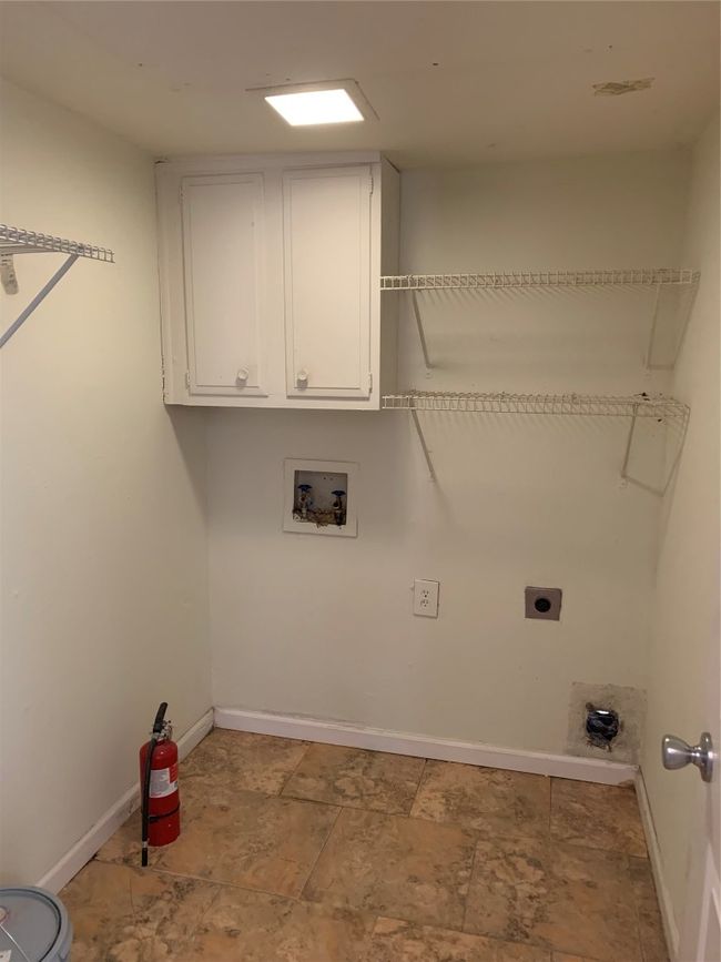Laundry room with cabinet space, washer hookup, electric dryer hookup, and baseboards | Image 16