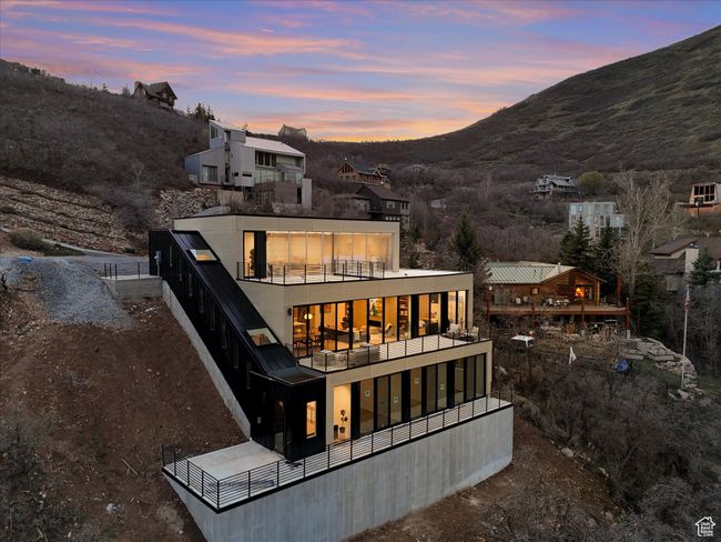 Back of house featuring a balcony and a mountain view | Image 35