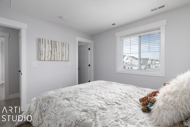 Bedroom featuring baseboards and visible vents | Image 27