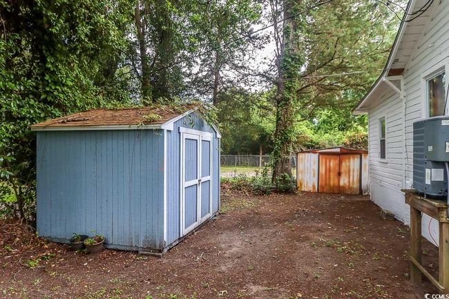 View of shed featuring view of wooded area | Image 18