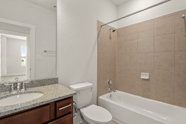 Full bathroom featuring shower / washtub combination, toilet, and vanity | Image 30