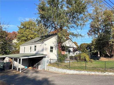 View of side of home featuring a carport | Image 3