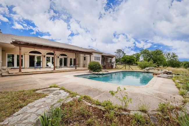 Outdoor pool featuring a patio with a pergola cover | Image 28