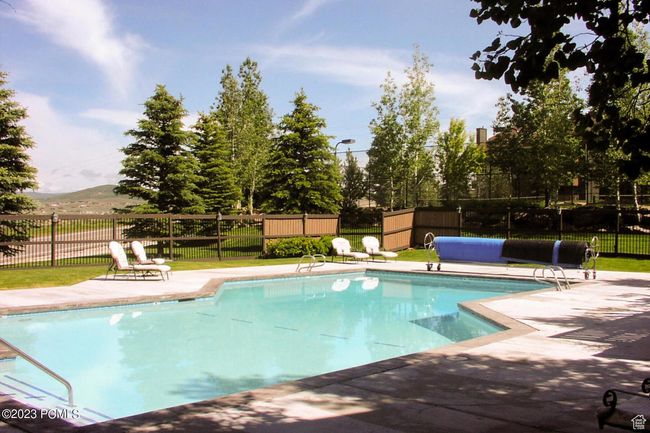 View of swimming pool with a patio area and a mountain view | Image 24