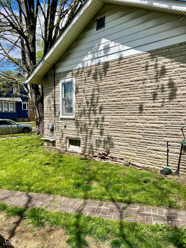 view of property exterior featuring a yard | Image 25