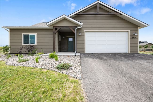 Ranch-style house with driveway, a garage, and a front lawn | Image 28