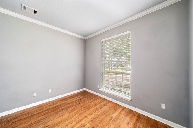 This bonus room sits adjacent to the dining and would be a perfect office space or conversation room/sitting area | Image 5