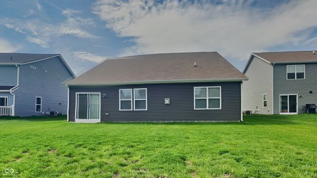 back of house featuring a yard and cooling unit | Image 16
