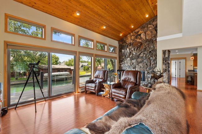 Second floor living room with expansive lake views | Image 6