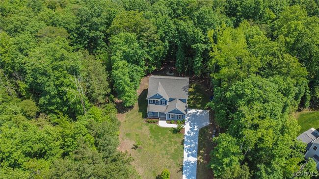 Aerial view highlighting private cul-de-sac location and nearly 1-acre wooded lot. | Image 35
