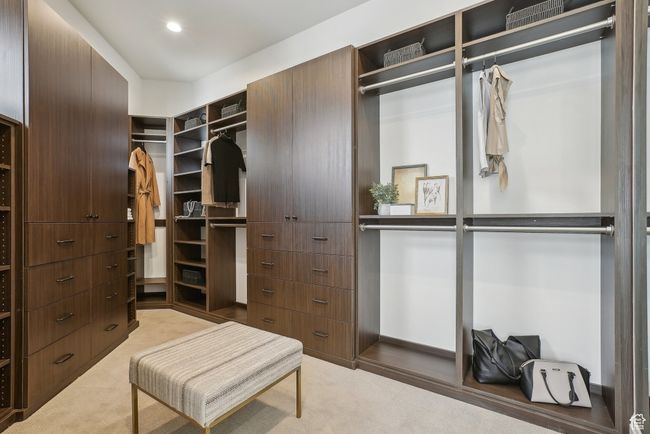 Spacious closet with light colored carpet | Image 27
