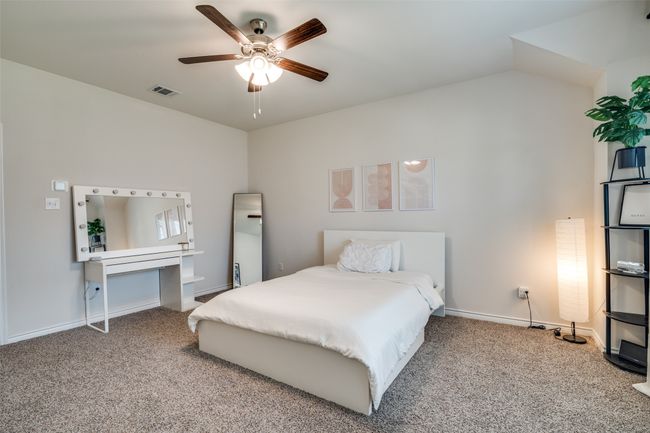 Carpeted bedroom with baseboards and a ceiling fan | Image 19