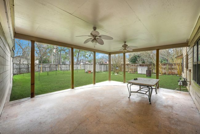 Large covered patio off the back of the home, perfect for entertaining. | Image 36