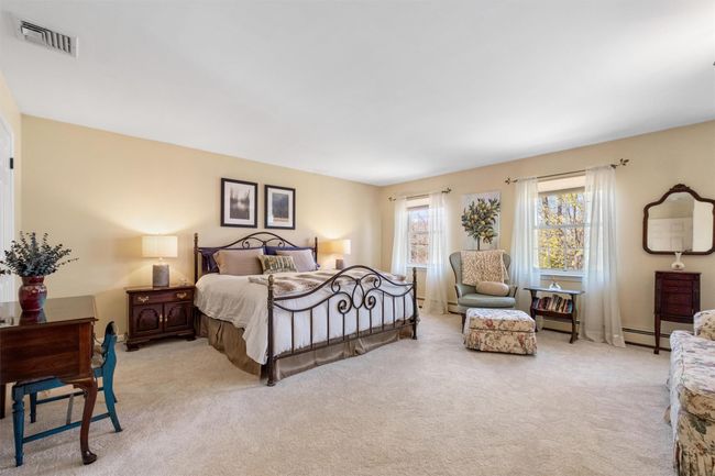 Expansive primary bedroom with plenty of natural light. | Image 24