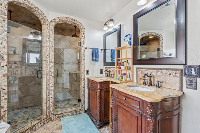 Framed mirrors, updated lighting, and furniture-style vanities! Yes, there really ARE 2 separate showers! You don't have to share with ANYBODY! | Image 18