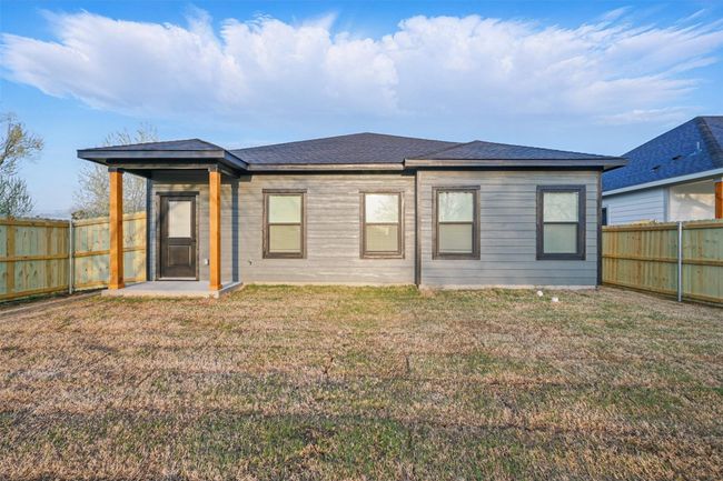 Back of house featuring a fenced backyard and a yard | Image 4