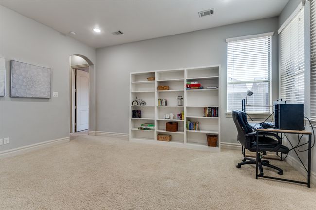 Office area featuring carpet, plenty of natural light, arched walkways, and visible vents | Image 22