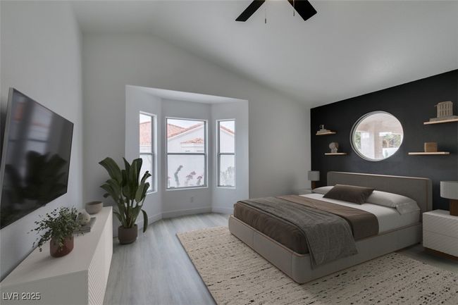 *Virtually Staged *Bedroom with vaulted ceiling, wood finished floors, baseboards, and ceiling fan | Image 15