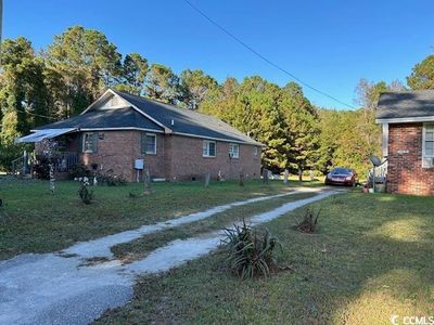 View of property exterior featuring a yard | Image 3