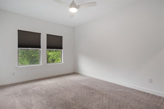 Carpeted spare room with ceiling fan and baseboards | Image 22
