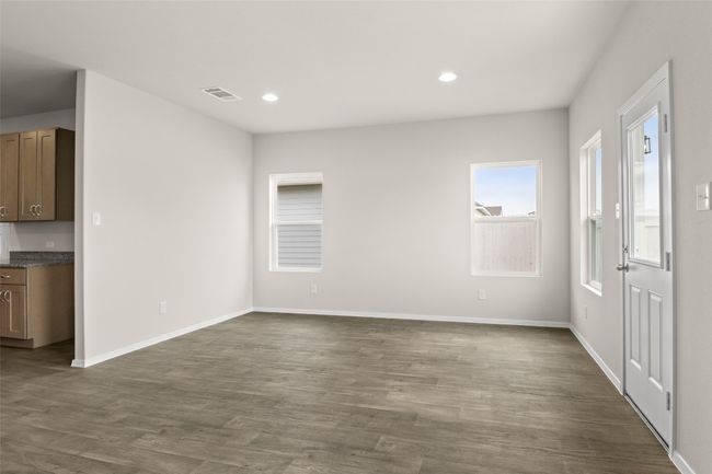 Unfurnished living room featuring visible vents, baseboards, recessed lighting, and dark wood finished floors | Image 13