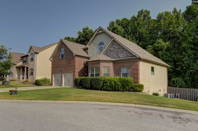 This home offers a totally finished basement perfect multi generational home | Image 2