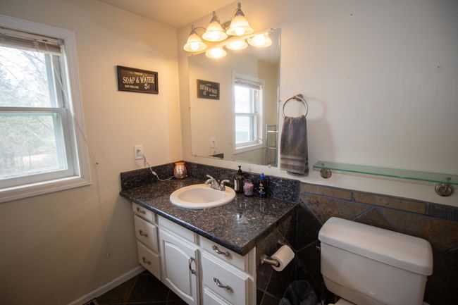 Main floor full bath with slate tile floor. | Image 14