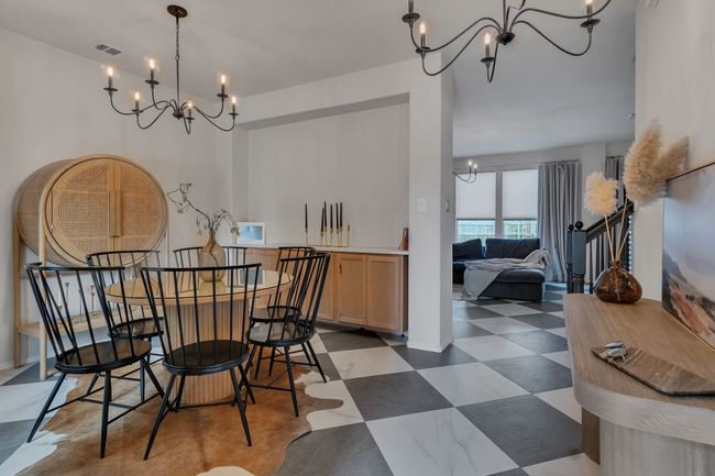Dining room featuring a chandelier and tile patterned floors | Image 4