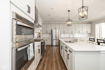 The kitchen and dining room combination is a dream for entertaining. | Image 3