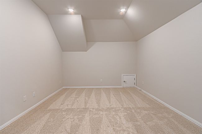 Bonus room featuring light colored carpet, vaulted ceiling, and recessed lighting | Image 33