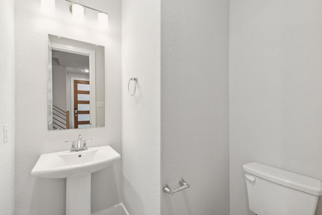 Half bathroom with toilet and a sink | Image 8