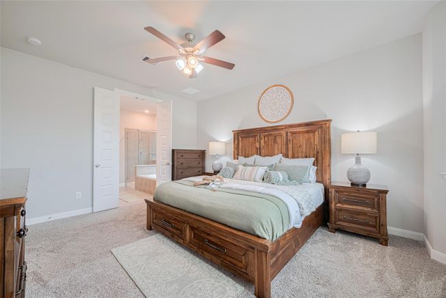 The room opens to a modern en-suite bathroom. | Image 25