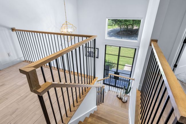 Staircase featuring a chandelier, high ceiling and you guessed it- Amazing views | Image 20