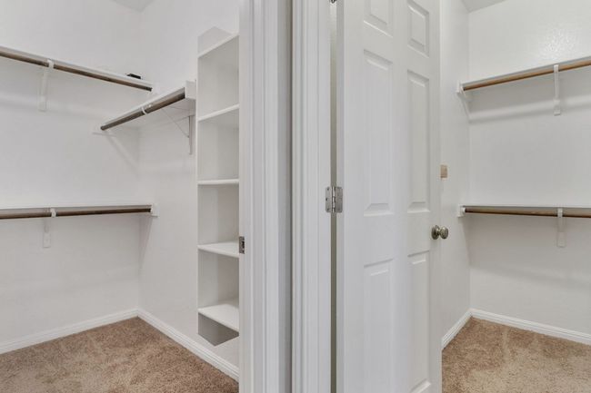 Walk in closet with carpet flooring | Image 26
