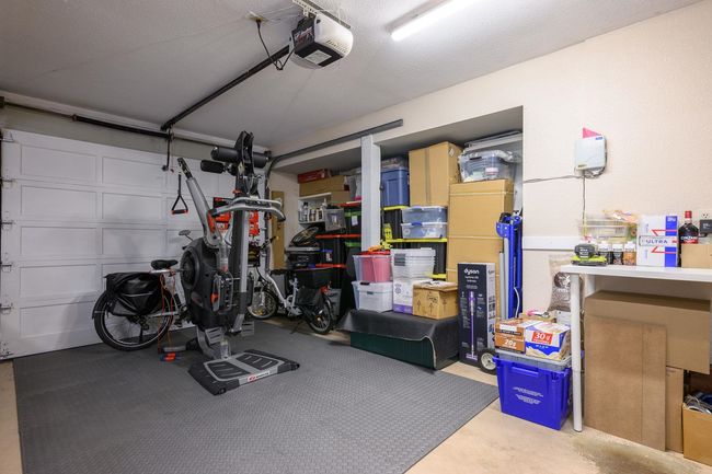 Garage featuring a garage door opener | Image 27