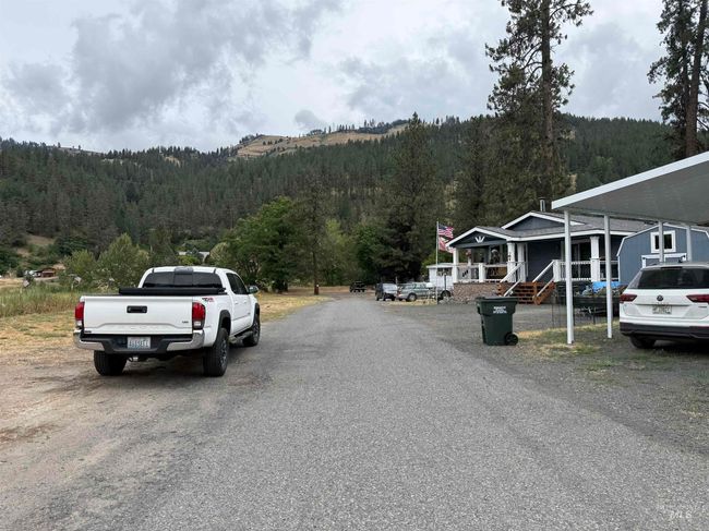 View of asphalt road featuring a forest view | Image 19