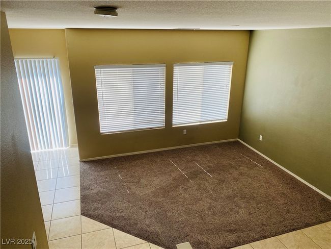 Carpeted empty room with baseboards and a textured ceiling | Image 24
